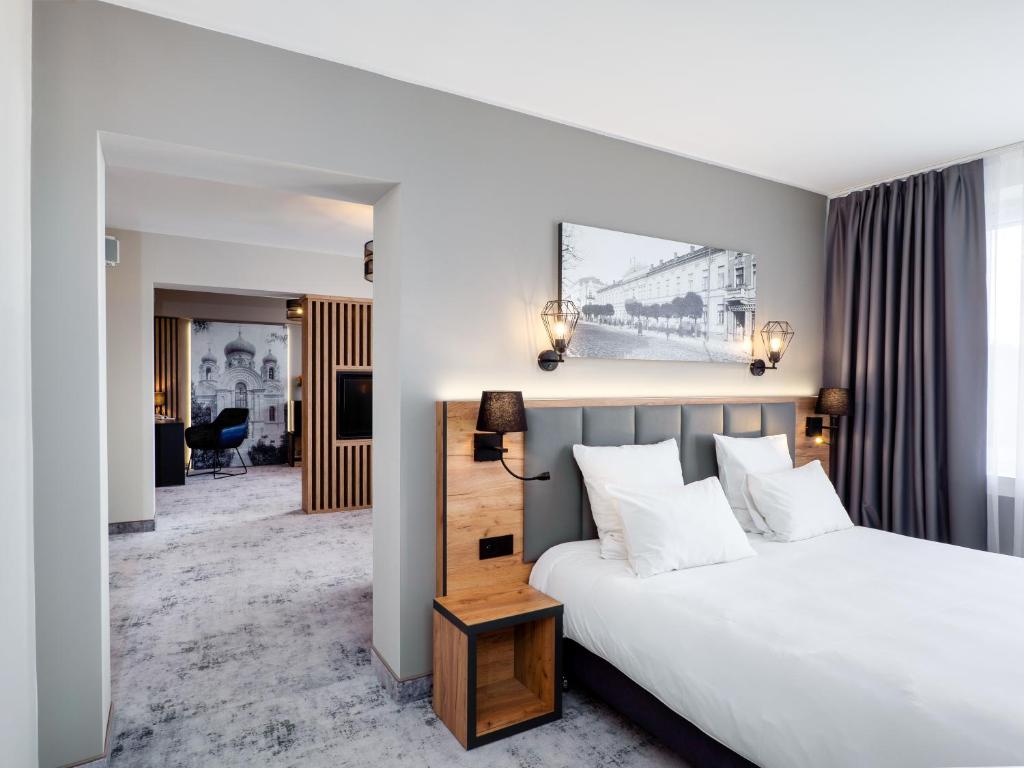 Posteľ alebo postele v izbe v ubytovaní Mercure Czestochowa Centrum