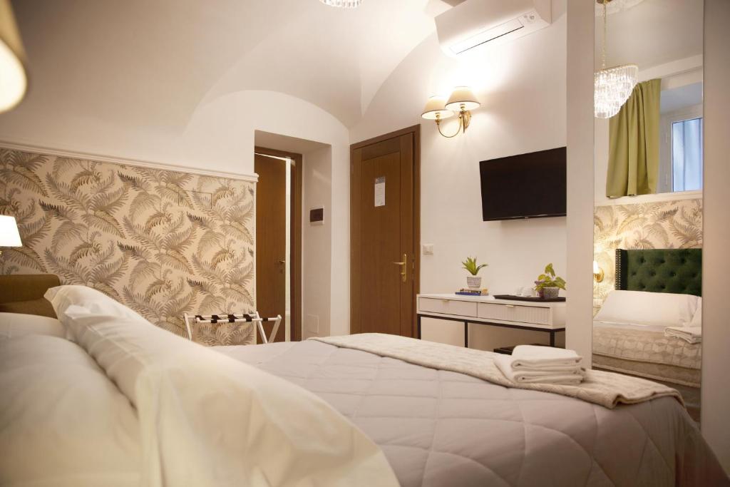 Postel nebo postele na pokoji v ubytování Hotel Silva