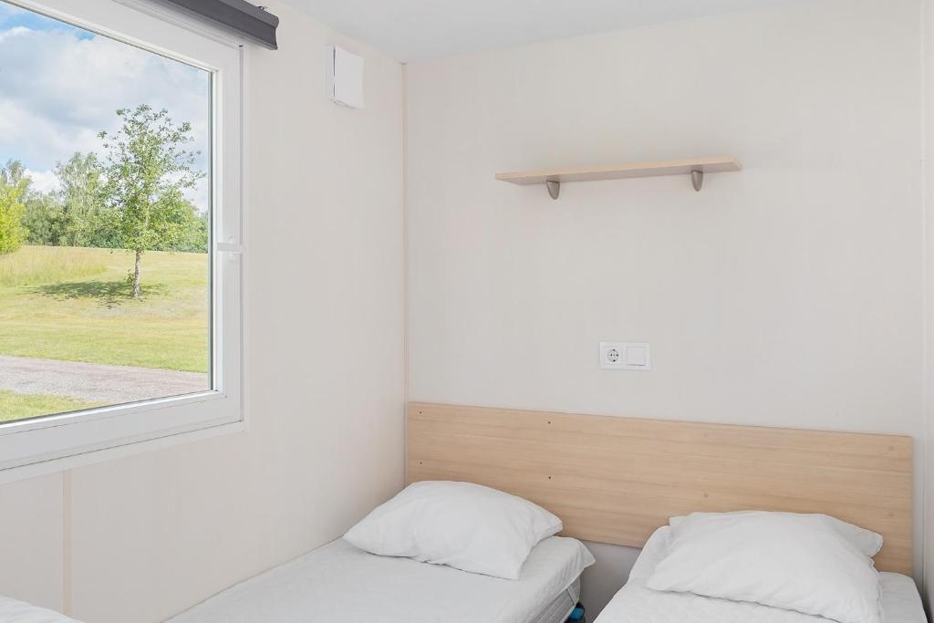 Postel nebo postele na pokoji v ubytování First Camp Röstånga-Söderåsen
