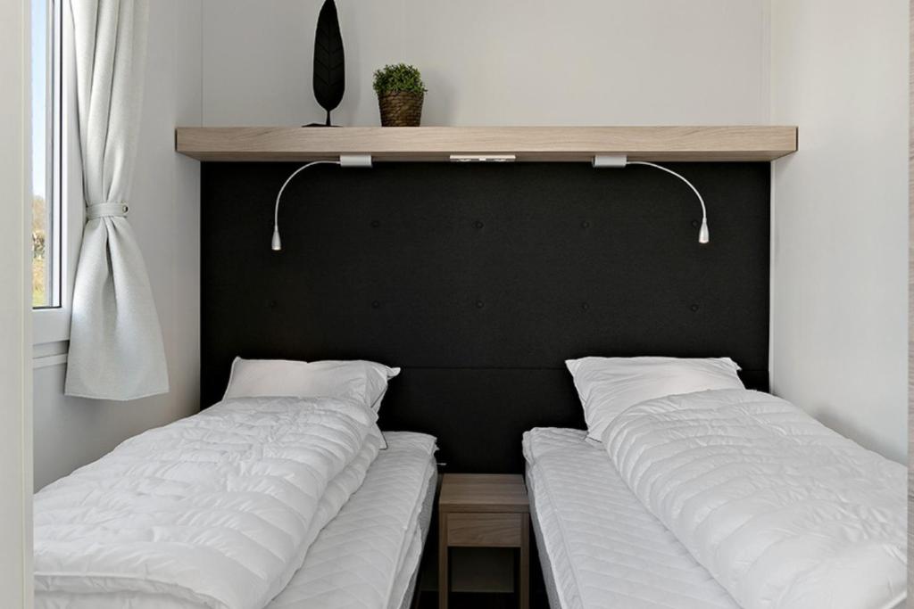 Postel nebo postele na pokoji v ubytování First Camp Röstånga-Söderåsen