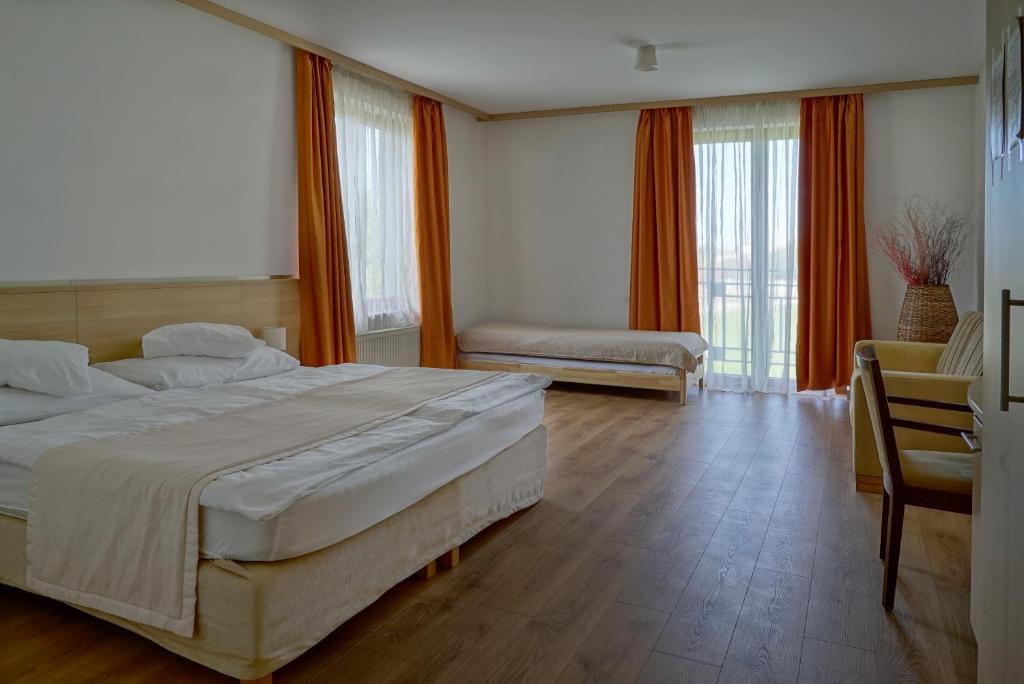 Postel nebo postele na pokoji v ubytování Hotel Legend