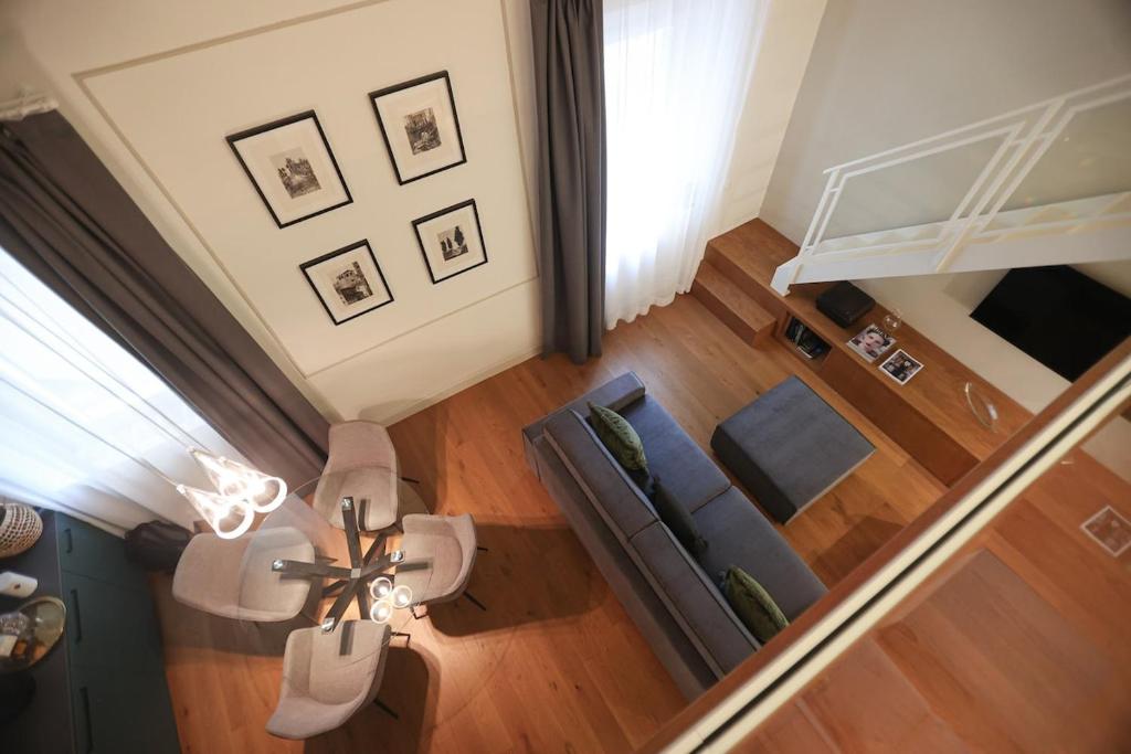 an overhead view of a living room with a couch and a table at Bargello Nine Luxury Suite in Florence