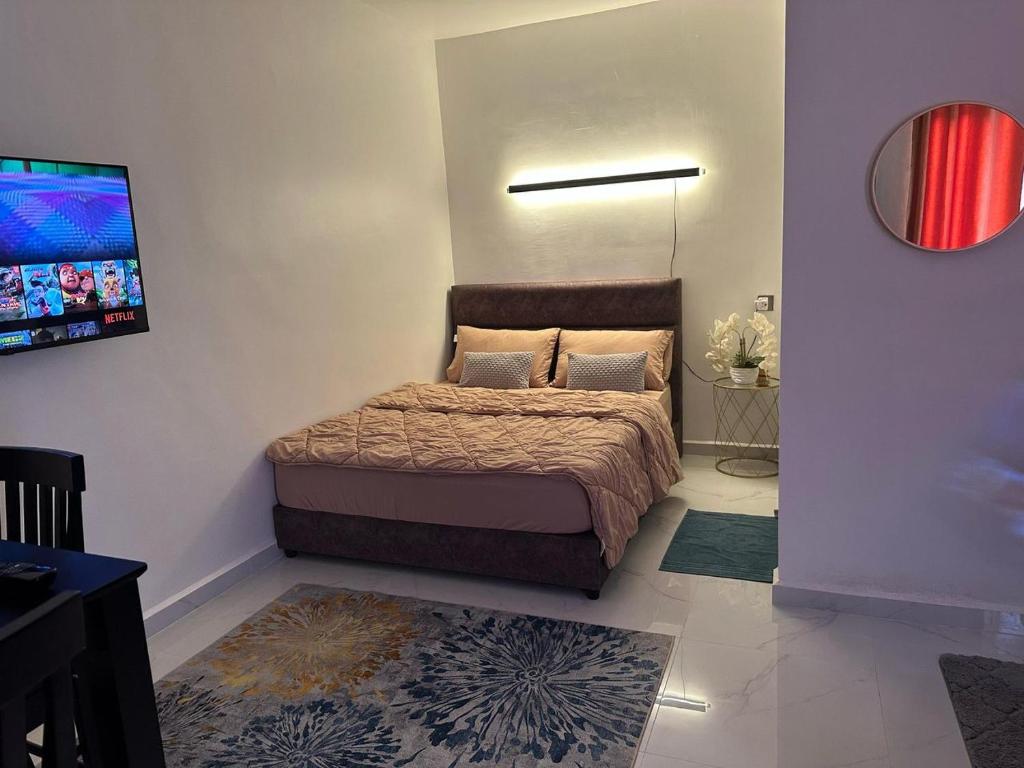 Voodi või voodid majutusasutuse PEARL Suite Sungai Karang Balok toas