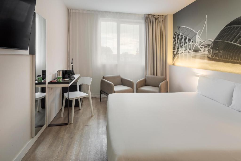 Postel nebo postele na pokoji v ubytování B&B HOTEL Valencia Ciudad de las Ciencias