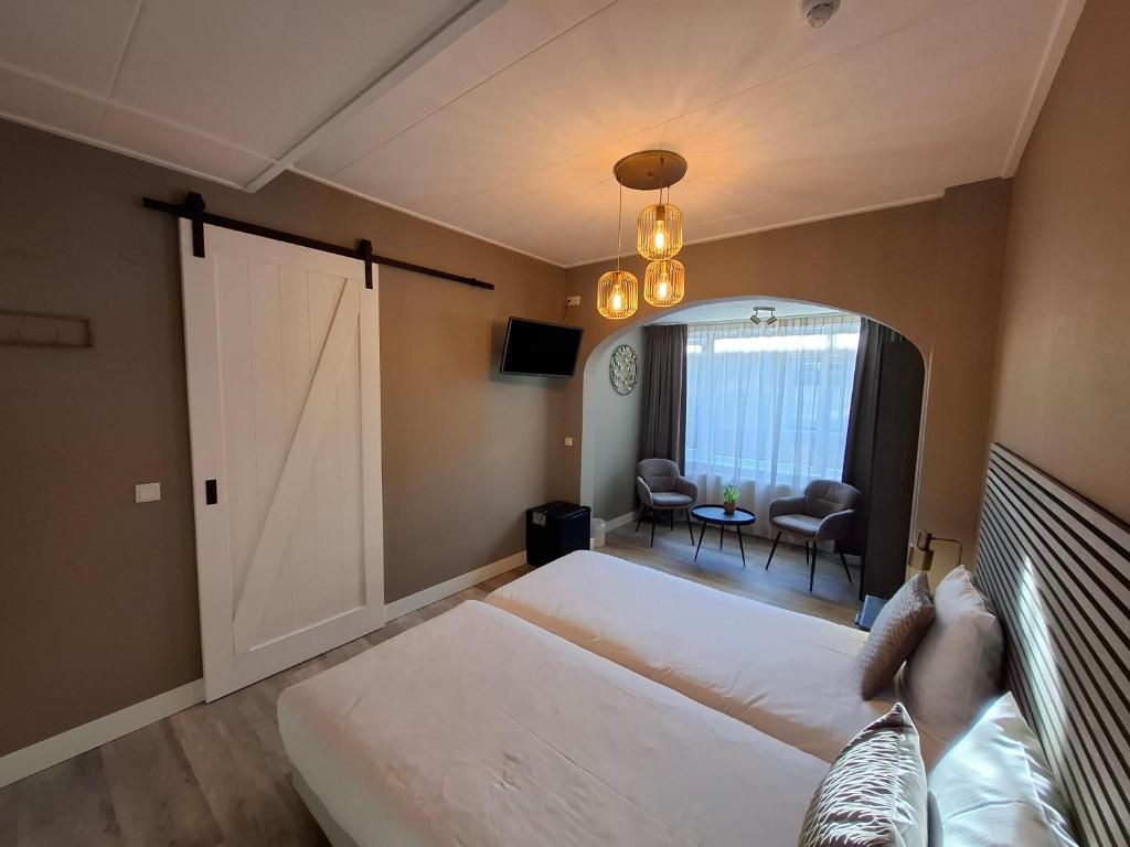 Postel nebo postele na pokoji v ubytování Hotel Randduin