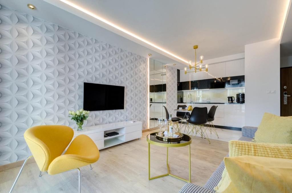 TV a/nebo společenská místnost v ubytování Apartamenty Angielska Grobla Q4Apartments