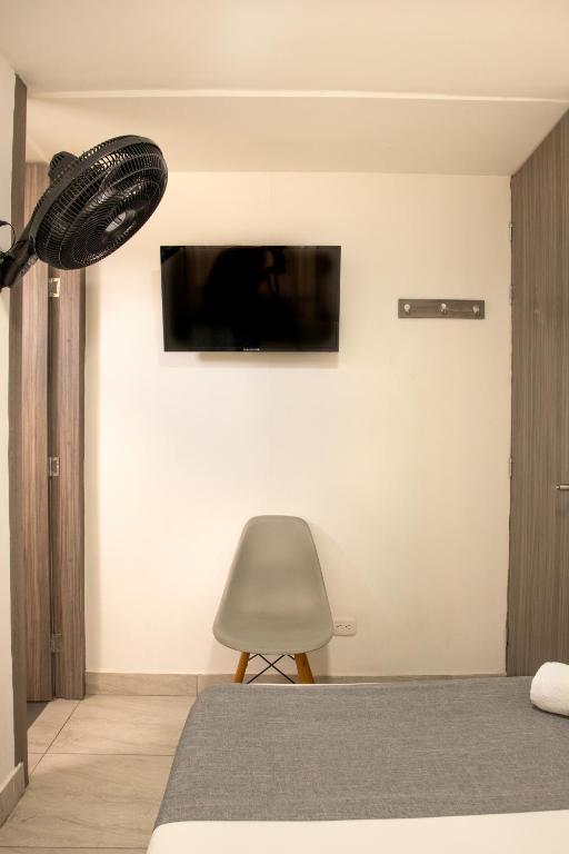 TV a/nebo společenská místnost v ubytování HOTEl INTER DEL CAFE