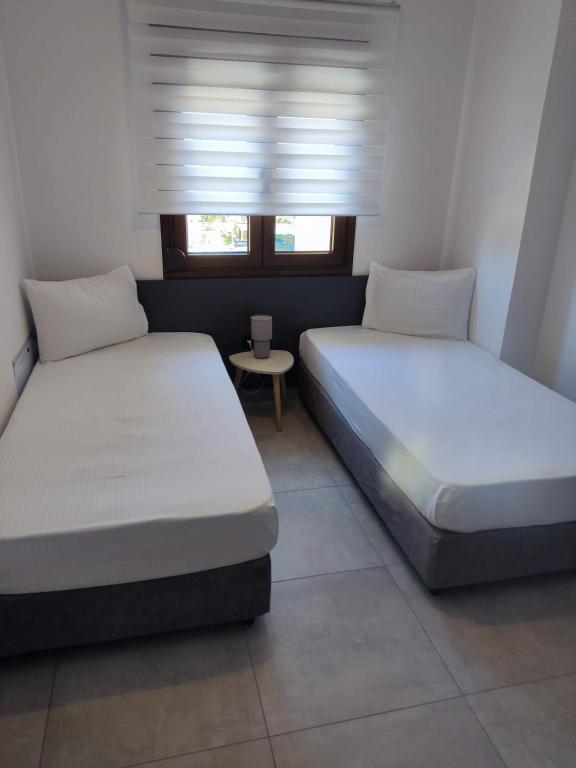 Posteľ alebo postele v izbe v ubytovaní Milias Apartment's