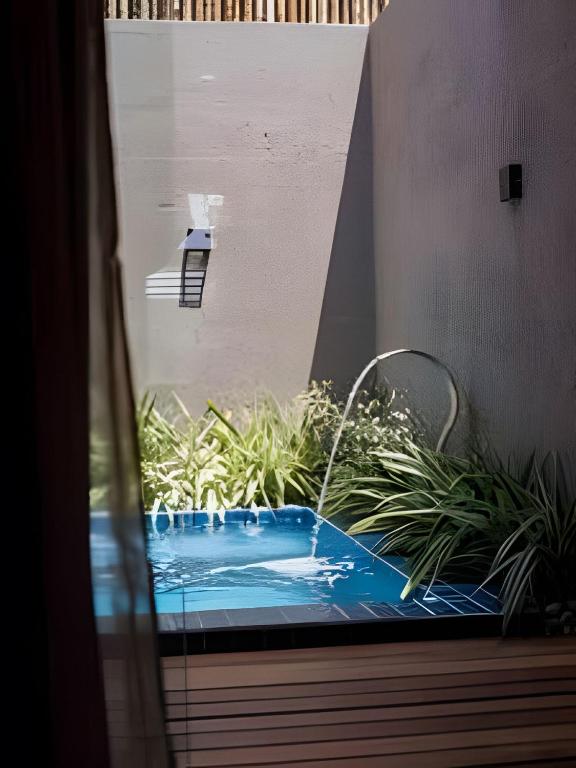 a view of a swimming pool through a window at Manga Verde Milagres in São Miguel dos Milagres