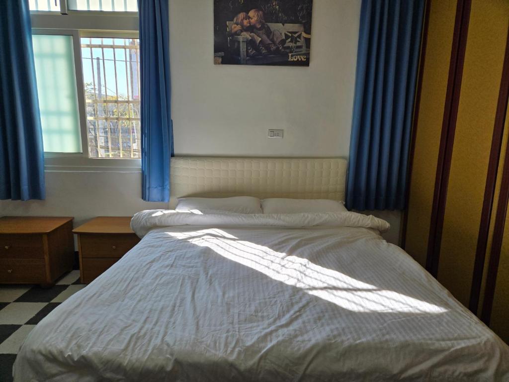 Postel nebo postele na pokoji v ubytování 高鐵中彰309民宿