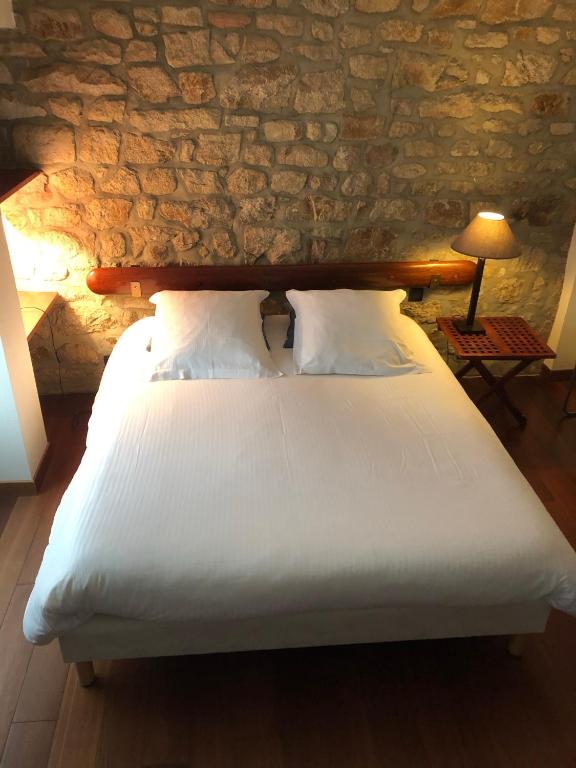 Postel nebo postele na pokoji v ubytování Le clos Saint Aubin
