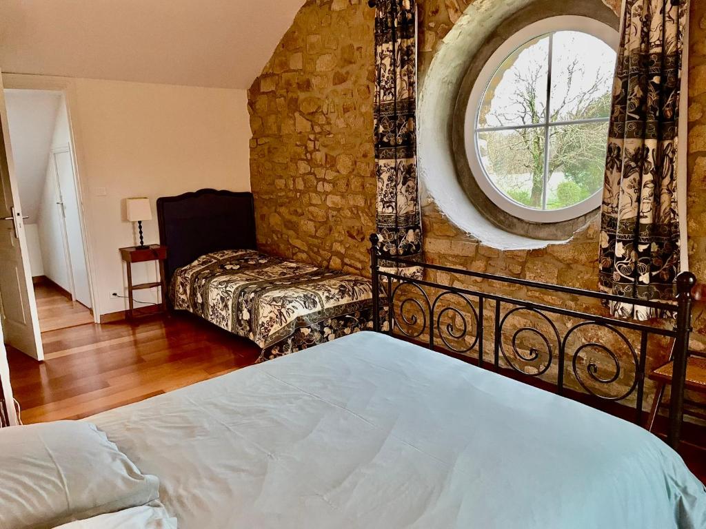 Postel nebo postele na pokoji v ubytování Le clos Saint Aubin