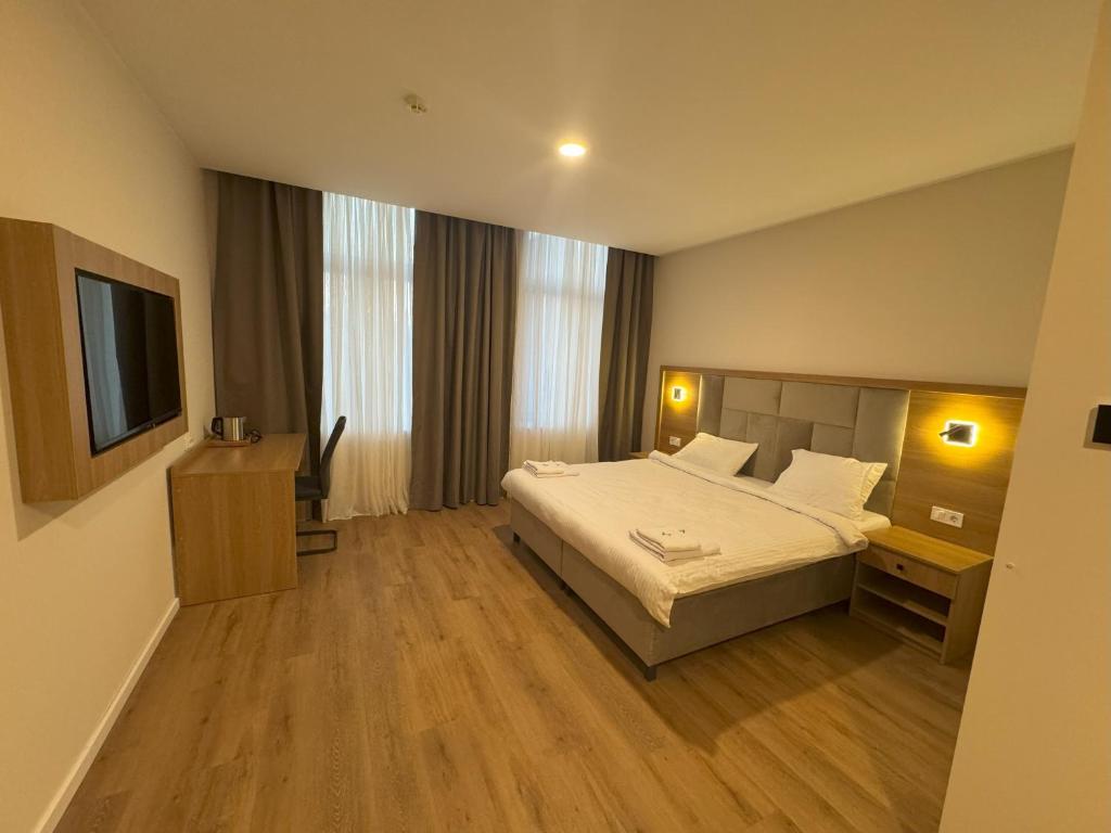 Postel nebo postele na pokoji v ubytování Promenaden Hotel