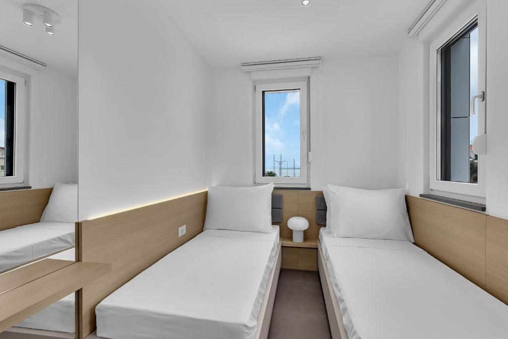 Postel nebo postele na pokoji v ubytování Perla Apartments Baska Voda