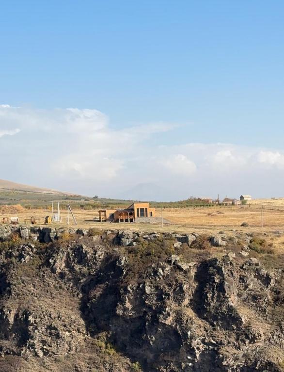 a house in the middle of a field at Denver Villa in Sagmosavan