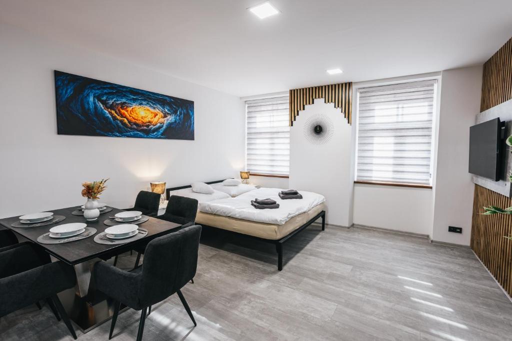 Ένα ή περισσότερα κρεβάτια σε δωμάτιο στο Apartmány U Doskočilů