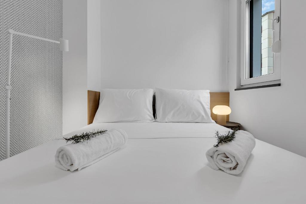 Postel nebo postele na pokoji v ubytování Perla Apartments Baska Voda