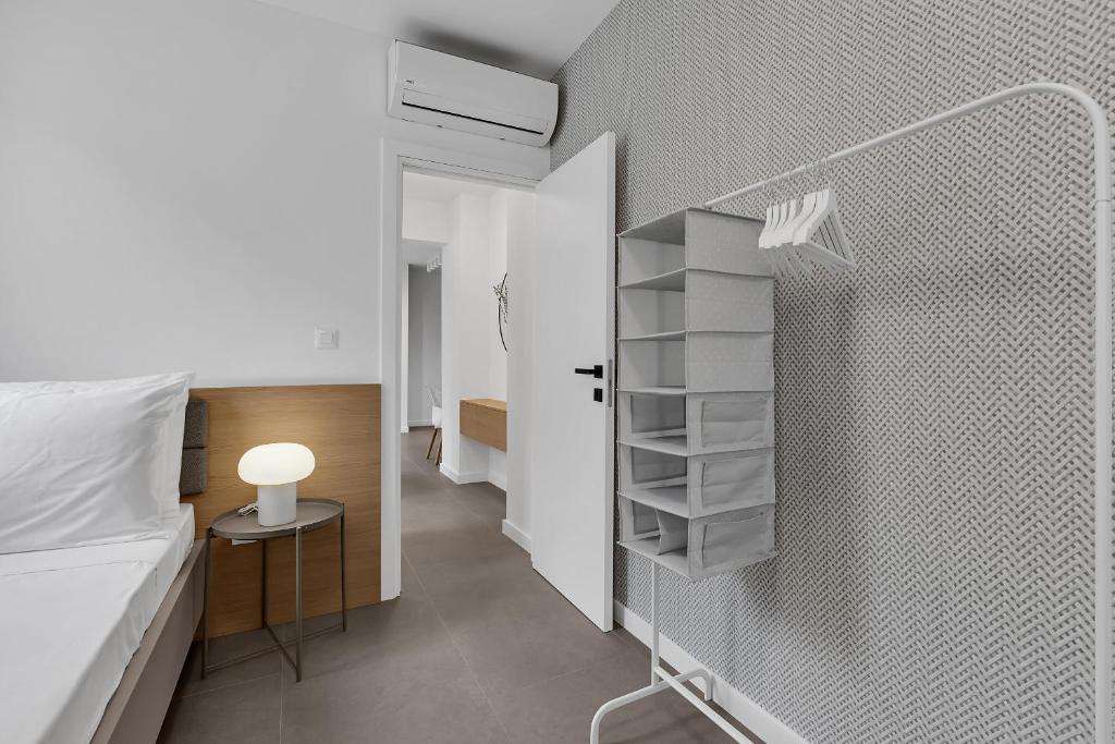Postel nebo postele na pokoji v ubytování Perla Apartments Baska Voda