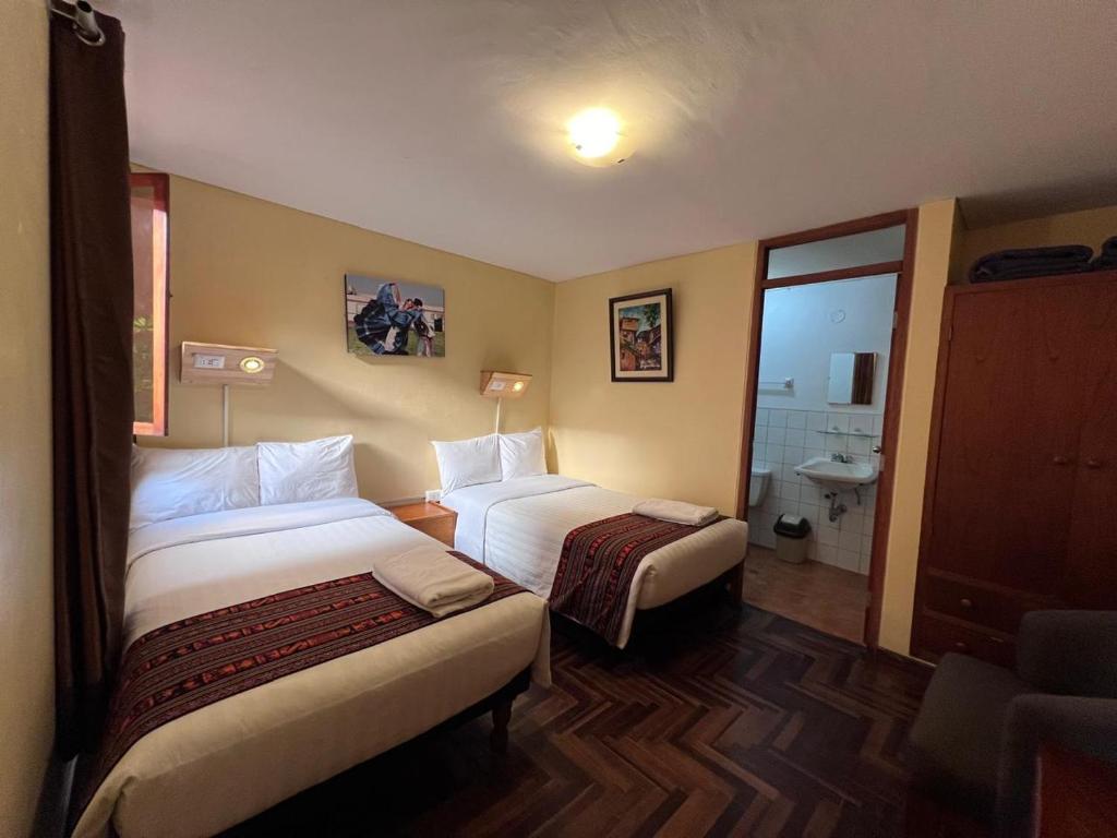 Postel nebo postele na pokoji v ubytování Eco Inn