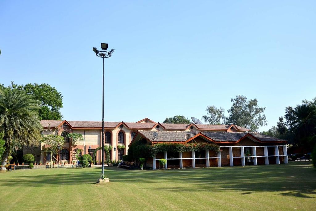 a large building with a street light in front of it at Ashok Country Resort in New Delhi