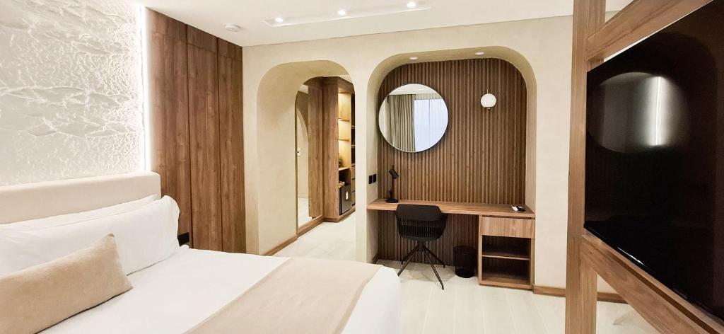 TV a/nebo společenská místnost v ubytování Botanico Hotel y Spa