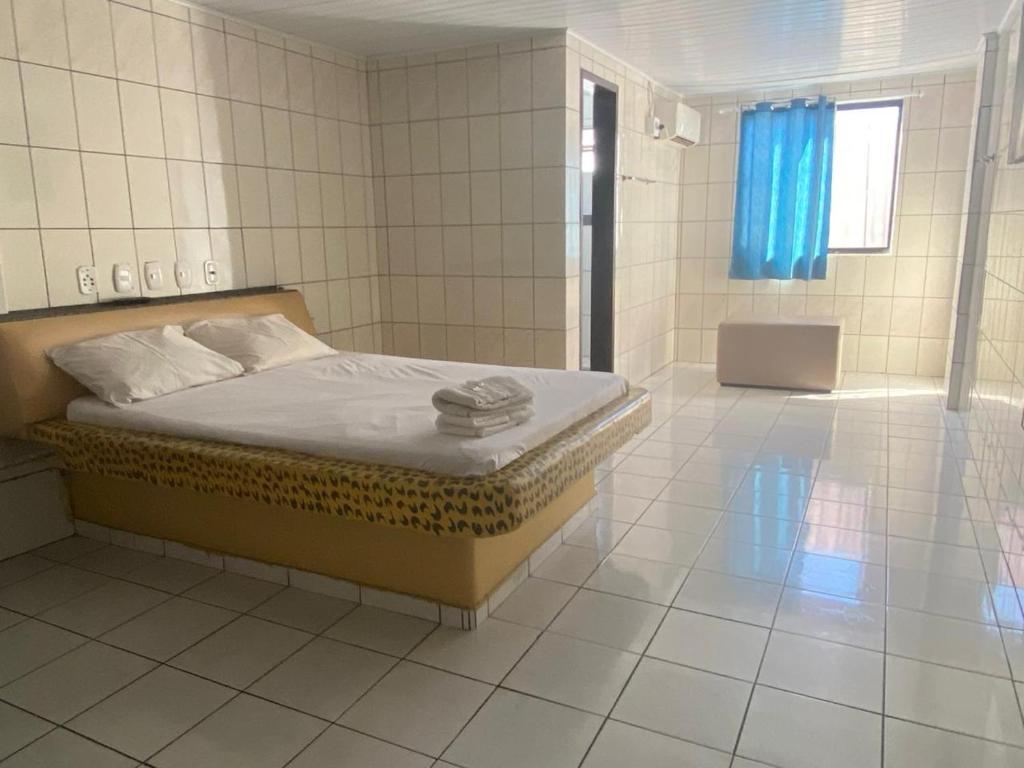 Postel nebo postele na pokoji v ubytování Hotel Extasy Brotas