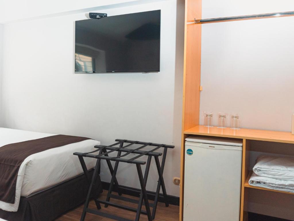 Ένα ή περισσότερα κρεβάτια σε δωμάτιο στο Hotel Ferré Miraflores