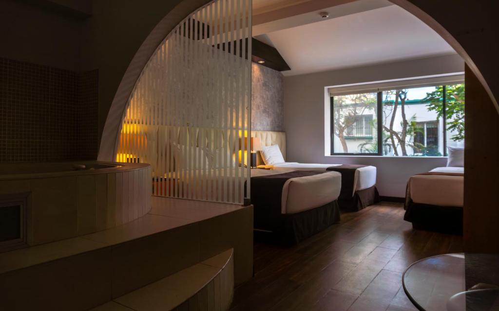 Ένα ή περισσότερα κρεβάτια σε δωμάτιο στο Hotel Ferré Miraflores