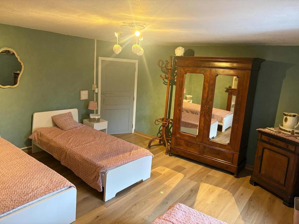 Postel nebo postele na pokoji v ubytování Gîte de la Ruelle
