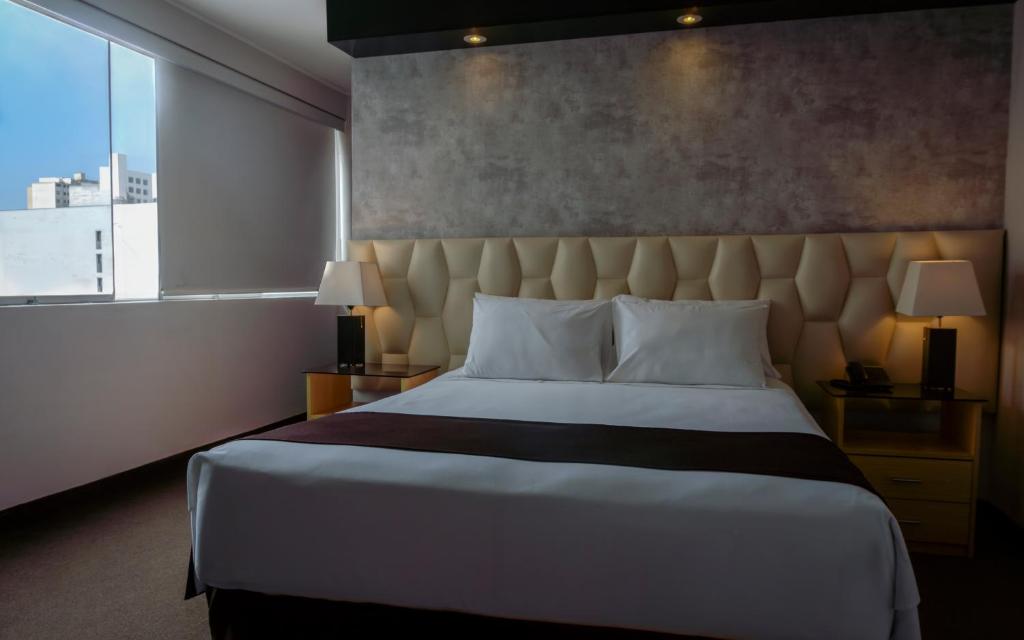 Ένα ή περισσότερα κρεβάτια σε δωμάτιο στο Hotel Ferré Miraflores
