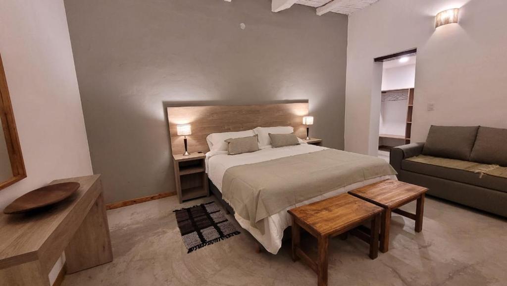 Postel nebo postele na pokoji v ubytování Adobe Hotel Fiambalá