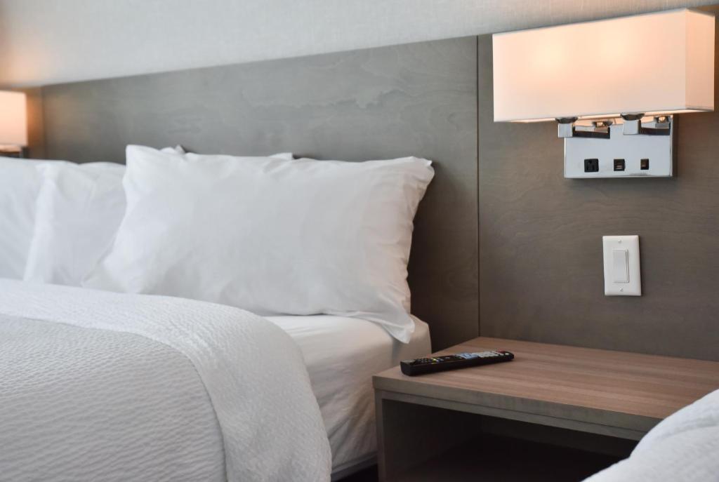 Postel nebo postele na pokoji v ubytování Repotel Levis