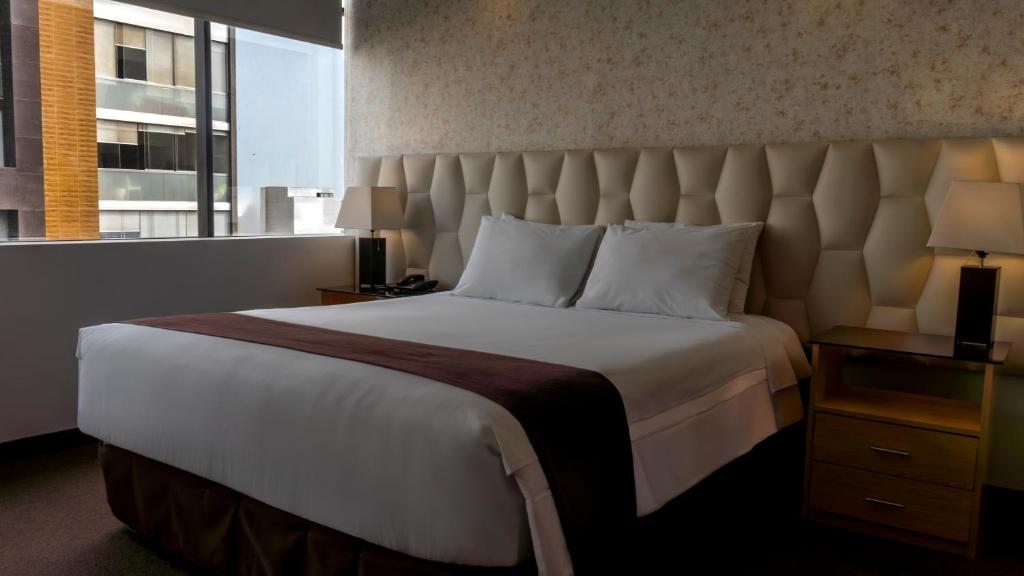 Ένα ή περισσότερα κρεβάτια σε δωμάτιο στο Hotel Ferré Miraflores