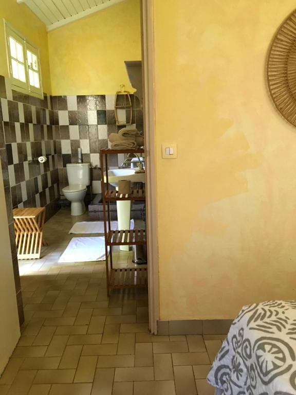 Una cama o camas en una habitación de Hotel Cap Sud Caraibes