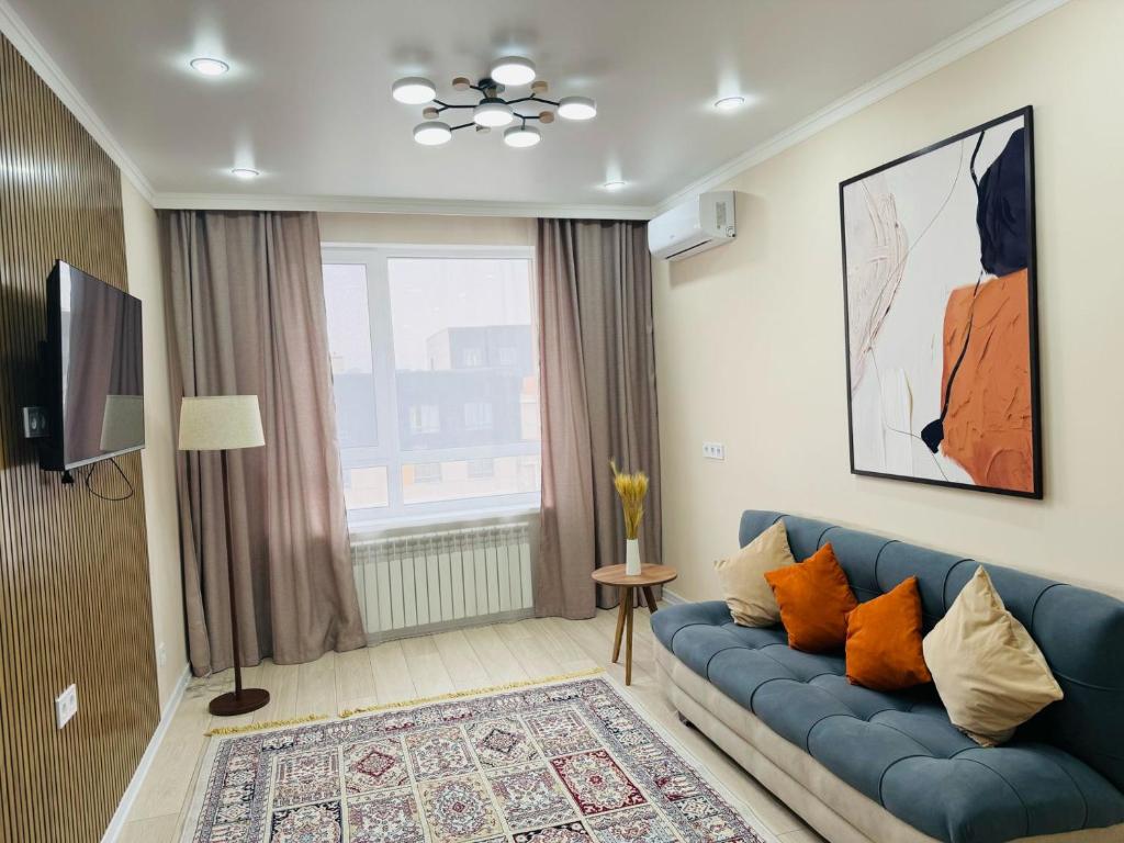 TV/trung tâm giải trí tại Almaty Aspan Comfort Apartment
