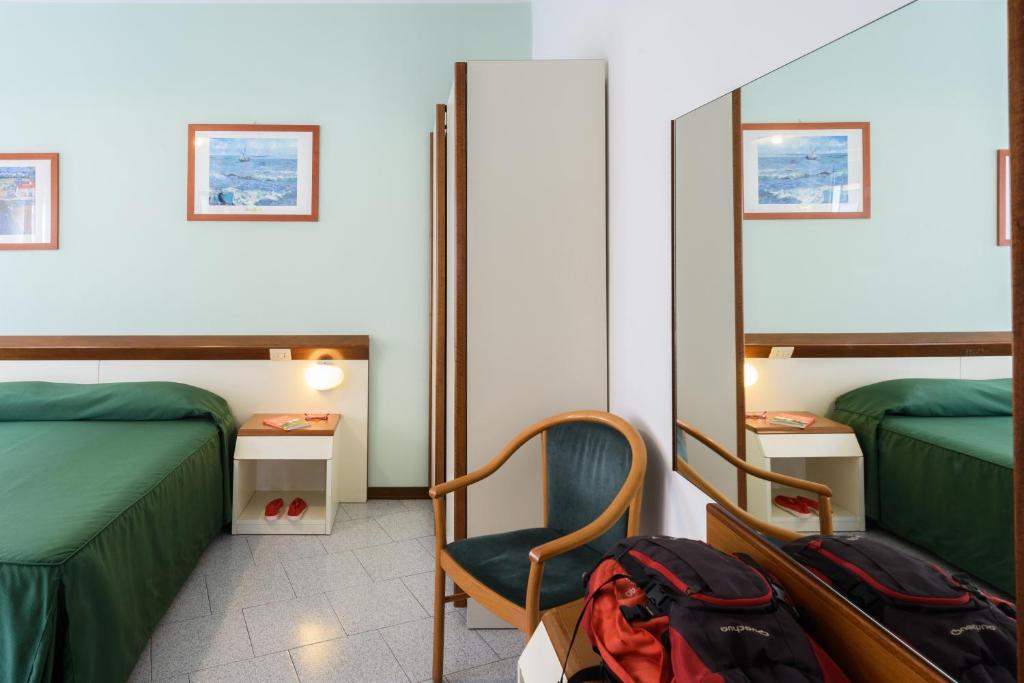 Postel nebo postele na pokoji v ubytování Hotel Italie et Suisse