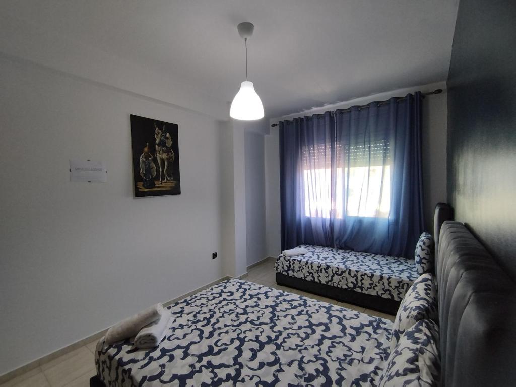 Postel nebo postele na pokoji v ubytování rabatcitycenterresidence