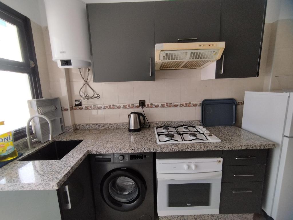 Kuchyň nebo kuchyňský kout v ubytování rabatcitycenterresidence