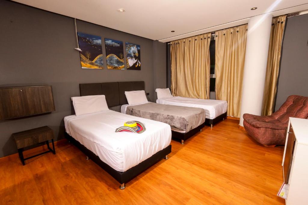 Postel nebo postele na pokoji v ubytování HOTEL HTL
