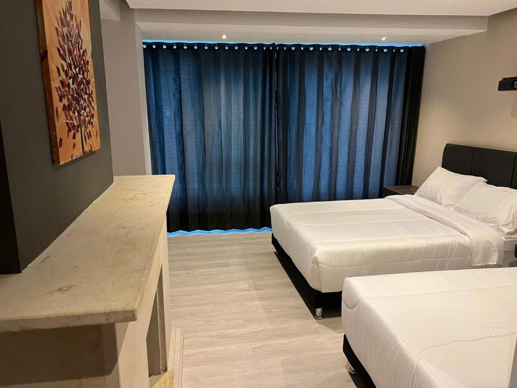 Postel nebo postele na pokoji v ubytování HOTEL HTL