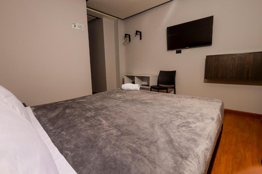 Postel nebo postele na pokoji v ubytování HOTEL HTL