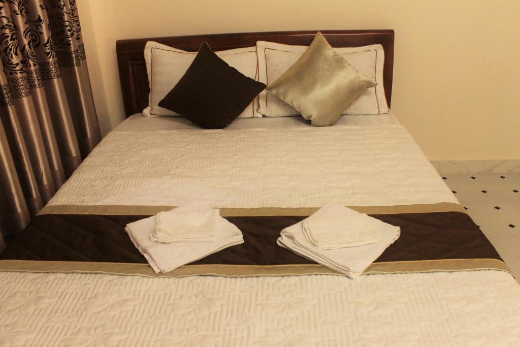 Postel nebo postele na pokoji v ubytování Nui Nho Motel