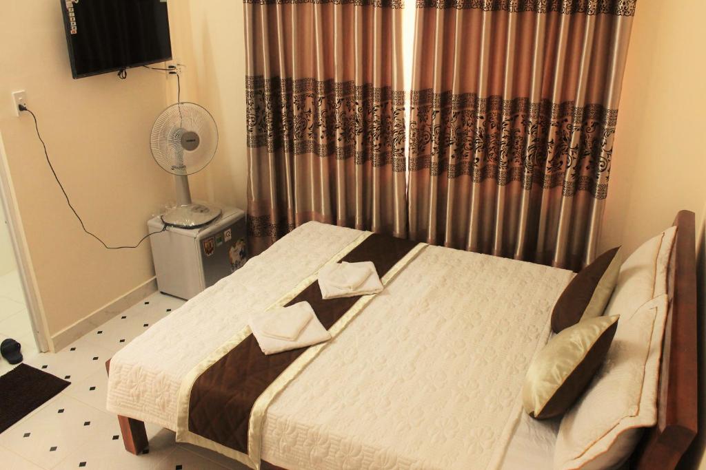 Postel nebo postele na pokoji v ubytování Nui Nho Motel