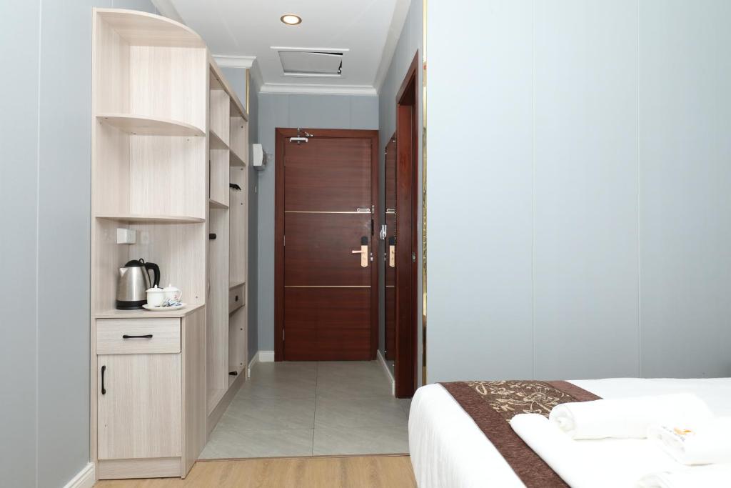 Postel nebo postele na pokoji v ubytování Yue Lai Hotel