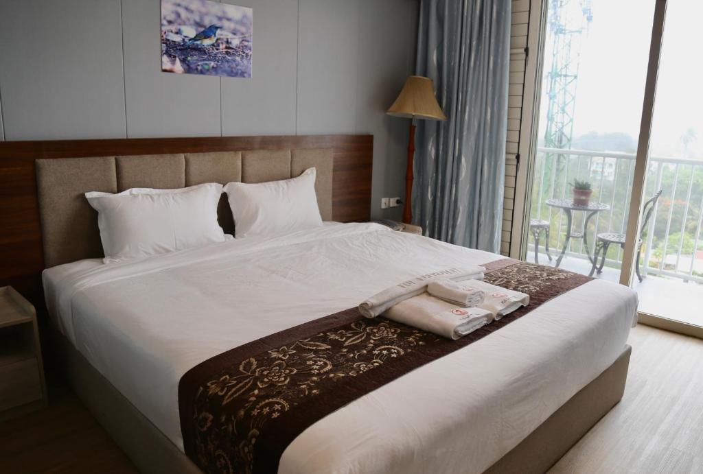 Postel nebo postele na pokoji v ubytování Yue Lai Hotel