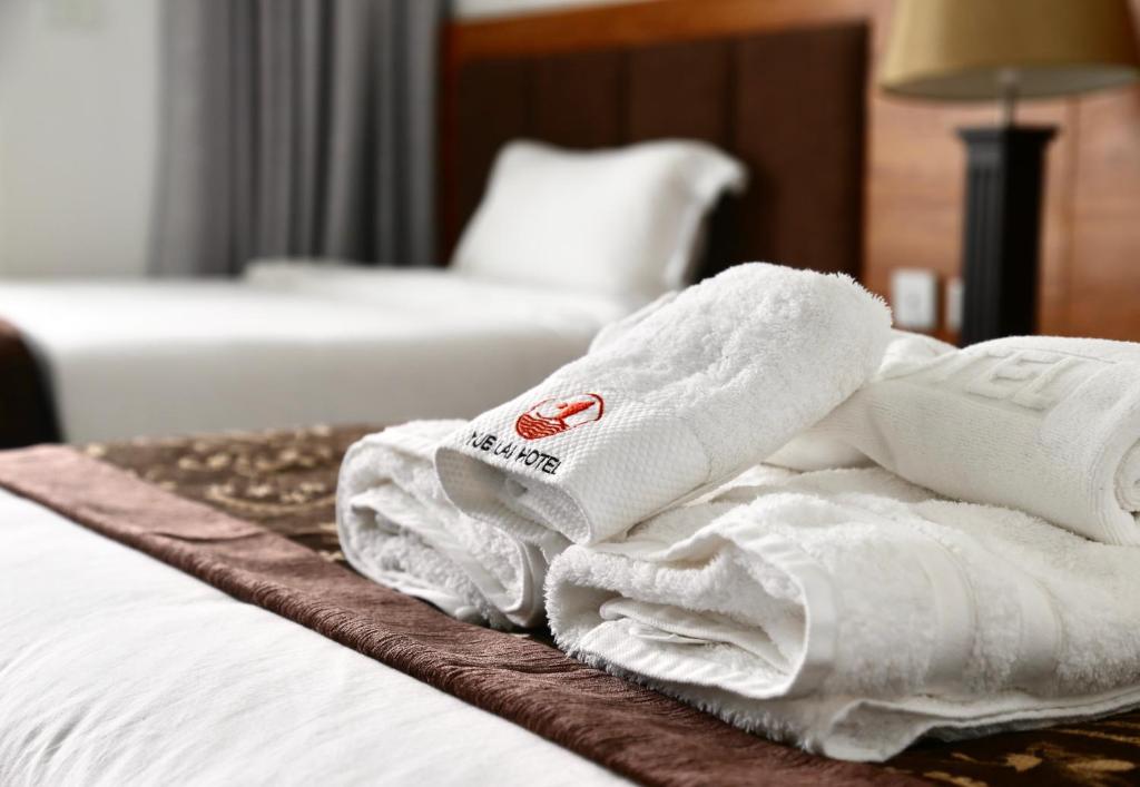 Postel nebo postele na pokoji v ubytování Yue Lai Hotel