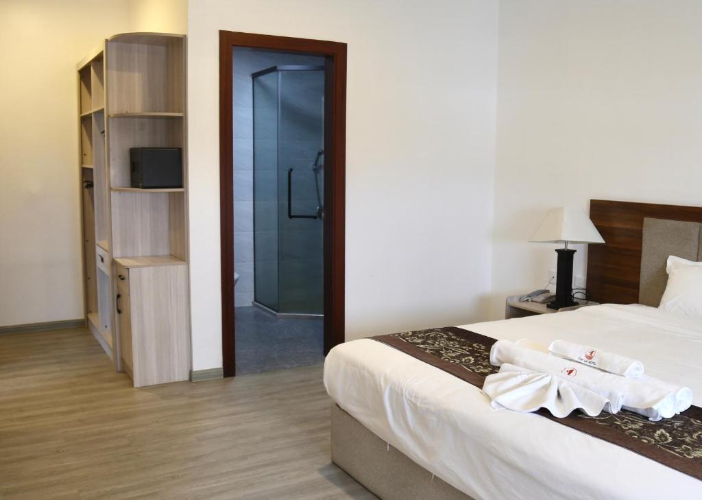 Postel nebo postele na pokoji v ubytování Yue Lai Hotel