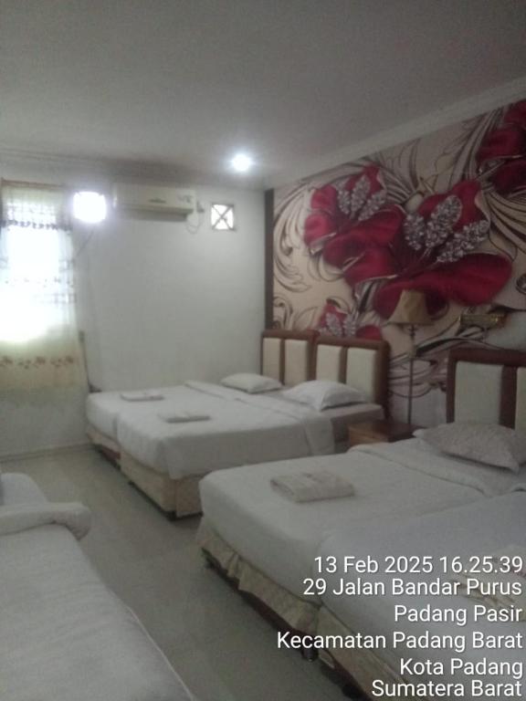 Postel nebo postele na pokoji v ubytování Hotel Alifa Syariah