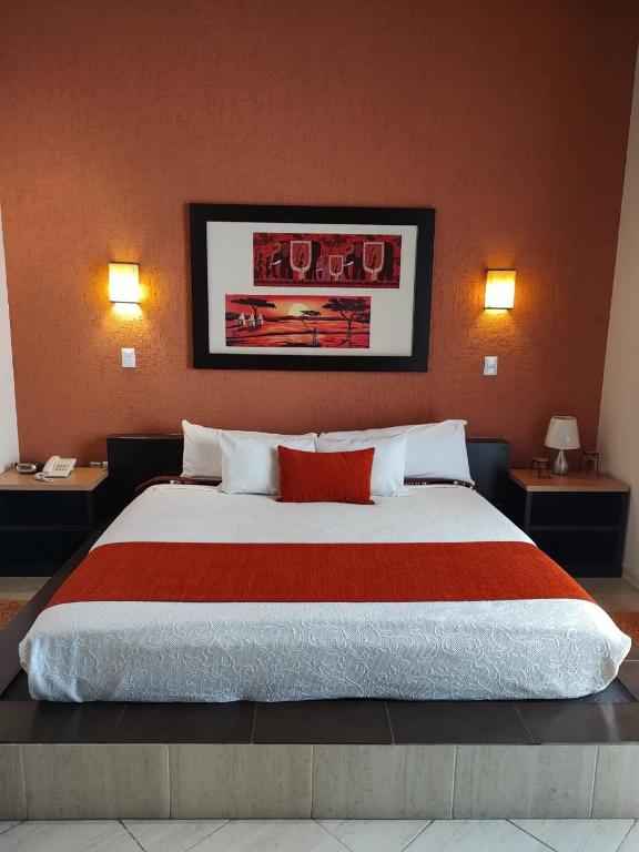 Postel nebo postele na pokoji v ubytování Hotel Real de TX