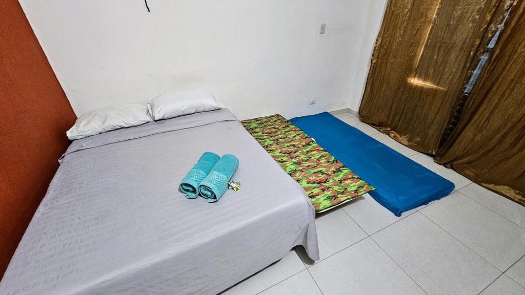 Postel nebo postele na pokoji v ubytování Suite 1 - Centro de Convenções700m, AC, WIFI